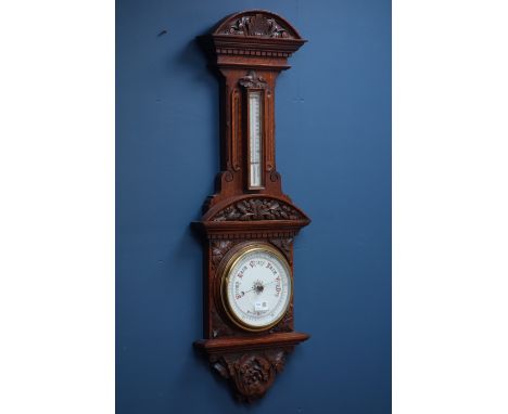 Victorian carved oak aneroid barometer with thermometer, H102cm CLOCKS & BAROMETERS - as we are not a retailer, these items a