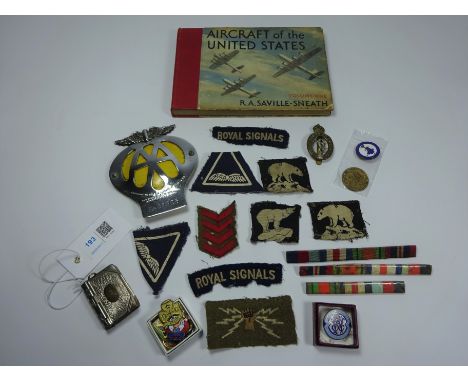 Military badges, bars, enamel badges, vesta case, AA car badge and a book on 'Aircraft of the United States'   Condition Repo