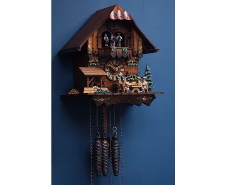Black Forest style cuckoo clock with moving beer drinkers and mill wheel, signed Schneider CLOCKS & BAROMETERS - as we are no