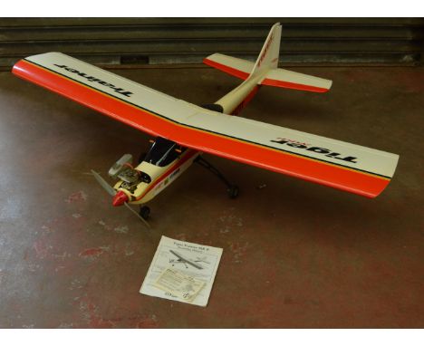 Tiger trainer radio controlled aircraft. Well built, fitted with OS max-46AX engine, servos etc. Wingspan 61" Fuselage length