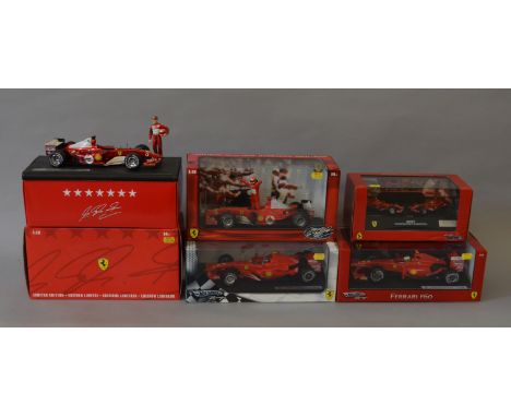 Four boxed  Hot Wheels Racing 1:18 scale Ferrari Formula 1 Racing Cars including  'Michael Schumacher 2004 World Champion' an