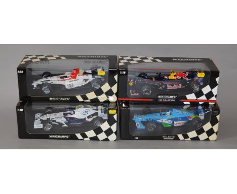 Four boxed Minichamps  1:18 scale Formula 1 racing cars including a B.A.R. Honda 006 - J. Button. All appear VG in G/VG boxes