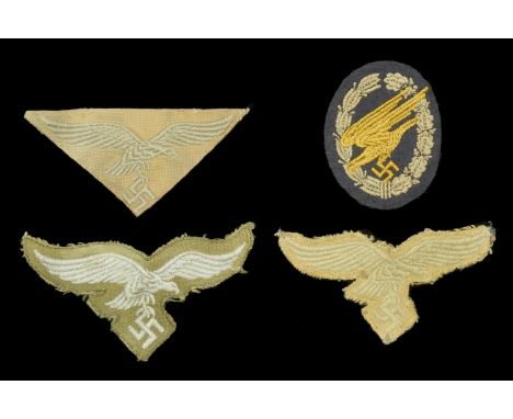 German Second World War Luftwaffe Tropical Insignia. Comprising a machine woven breast eagle on light tan/green backing mater