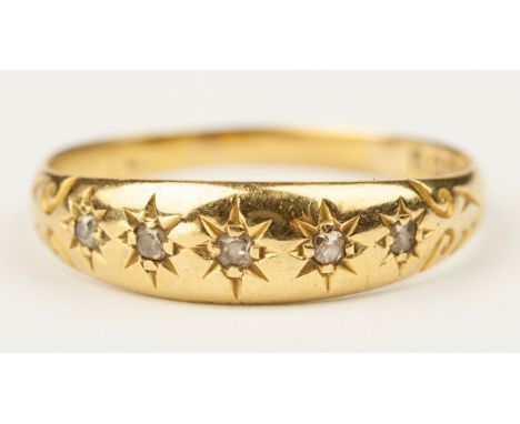 Star set with 5 old cut diamonds in a 18ct yellow gold band , ring size K