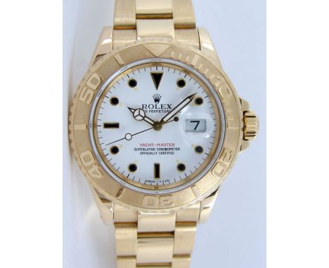 Reference number 16628, the 40mm round white dial with baton and dot hour markers, calibrated outer ring, date aperture at 3 