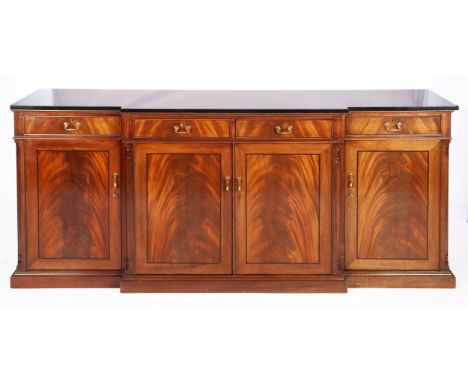 The rectangular breakfront black marble top above four frieze drawers and four doors enclosing a shelf, on a plinth base92cm 