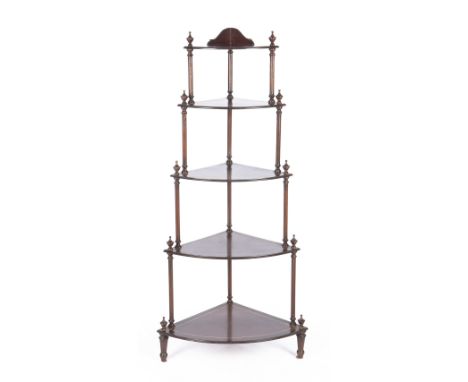 Each fan-shaped shelf on turned supports surmounted with vase finials140cm high