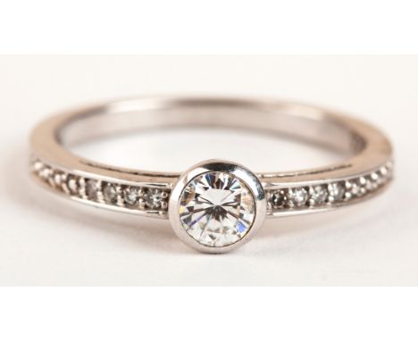 Bezel set to the centre with a round brilliant cut diamond weight approximately 0,15 carats colour HI clarity VSSI in sterlin