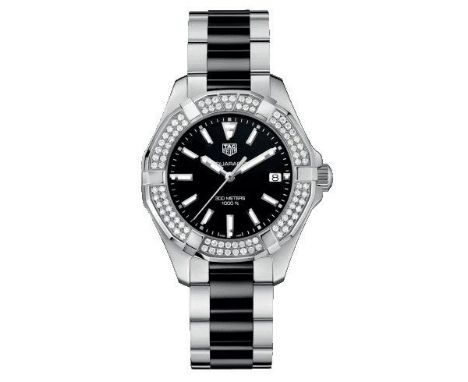 Reference number WAY131E, the 30mm round black dial with calibrated outer ring and baton hour markers, date aperture at 3 o' 