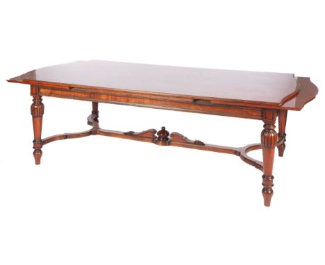The rectangular top with serpentine ends on lobed, turned and ring-turned tapering legs, joined by wavy stretchers.78cm high,