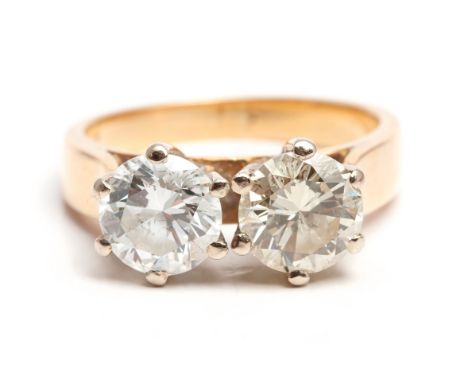 Claw set with a pair of round brilliant cut diamonds - near matching. The first weight approximately 1,00 carats colour GHI c