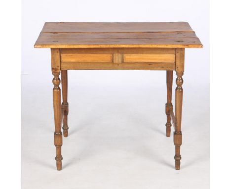 The rectangular two-plank top above a moulded frieze on turned and ring-turned tapering legs with square-section stretchers77