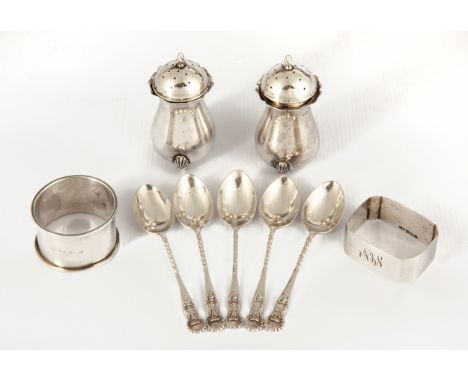 Comprising two silver napkin rings, Birmingham 1947 and Chester 1926, initialled PG, two salt cellars, Birmingham 1925, on fo