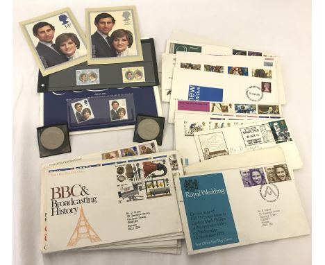 A collection of first day covers together with 2 commemorative Charles and Diana wedding coins and stamp presentation book. 