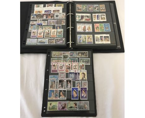 A Silver Jubilee Commemorative stamp album. Containing Commemorative postage stamps of The British Commonwealth, postage stam