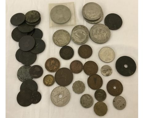 A tray of mixed vintage coins. To include half crowns, Georgian pennies and Commonwealth coins.  