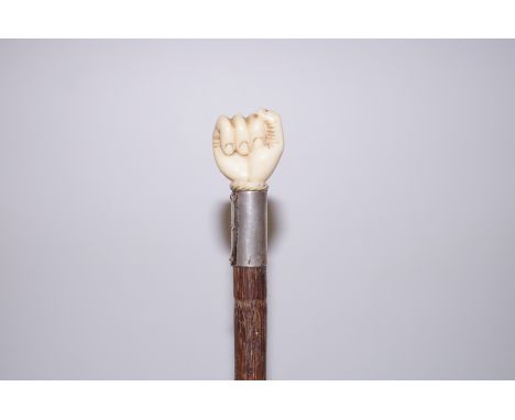 Sailors hand walking stick made from whales tooth with silver collar 