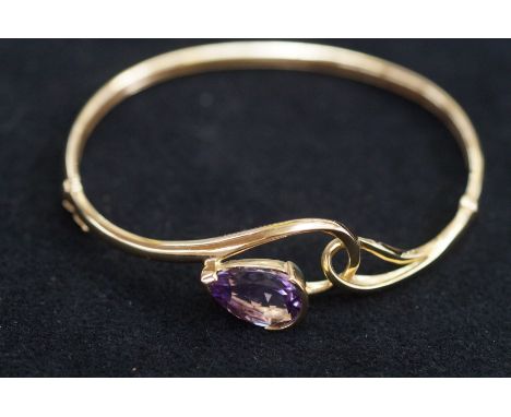 9ct Gold bangle with pear shaped amethyst Weight 9.6 g