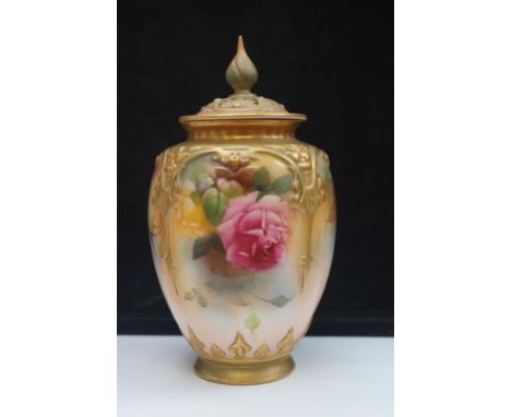 Royal Worcester lidded vase pierced decoration to lid, green backstamp, minor rubbing to tip of finial Height 16 cm 