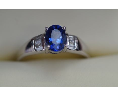 18ct White gold ring set with tanzanite &amp; diamond, diamond weight 0.10 carat with coa Size R