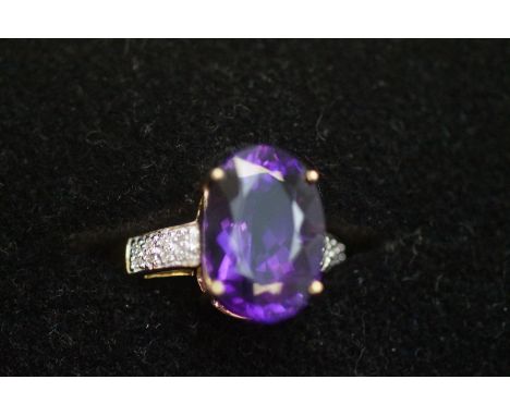 9ct Yellow gold ring set with large oval amethyst &amp; diamond shoulder, with tag Size O