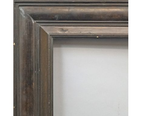 An Ebonised Dutch Style Frame, late 20th century, with cavetto ogee sight, torus, reverse wedge, cushion moulded frieze and o