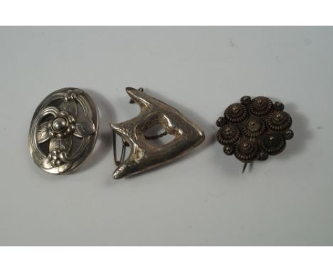 A Georg Jensen silver brooch, London 1965, of oval flower head form, approx 4cm, together with a circular silver wire-work br