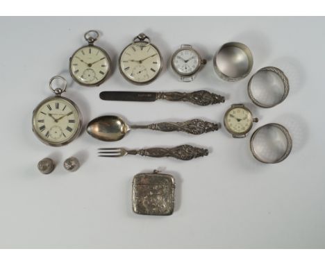 A miscellaneous collection of silver items to include three various open face key wind pocket watches, lacking keys and two w