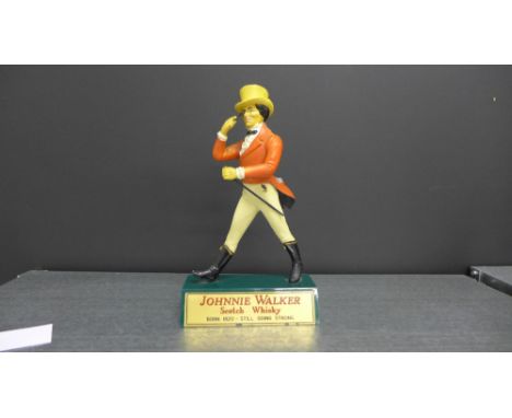 A vintage Johnnie Walker Scotch Whisky advertising figure, 21cm high