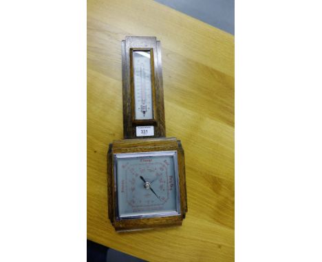 An oak cased wall Art Deco style wall barometer