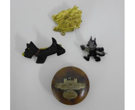 Sterling silver and black enamel cat brooch, a Scottie dog brooch, Girl Adventurers gilt metal brooch and a faux tortoiseshel