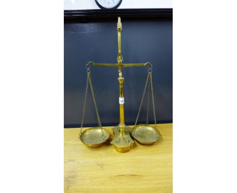 A set of brass balance scales and weights
