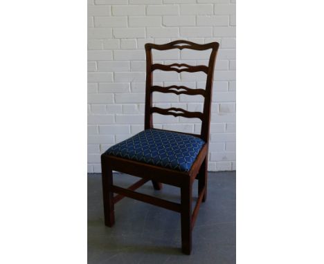 A 19th century mahogany ladder back chair with a curved top rail and slip in upholstered seat on block supports on stretchers