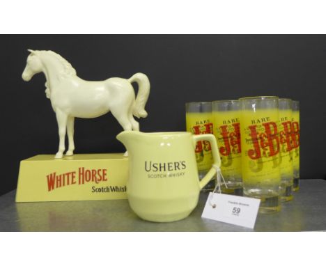 A White Horse Scotch Whisky advertising figure together with an Usher's Scotch Whisky water jug by Wade and a set of six J & 