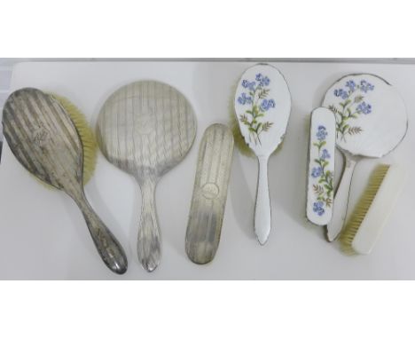 Dressing table brush sets to include a silver backed two part  set and a silver plated and white guilloche enamel three piece