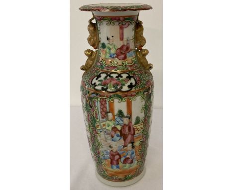 A vintage Chinese hand painted Famille Rose vase with figural panel design front &amp; back. Gilt foo dogs to each side of va