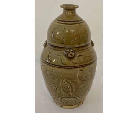 A slim necked brown/yellow glaze ceramic vase with fish and lotus flower detail.  Approx. 18cm tall.