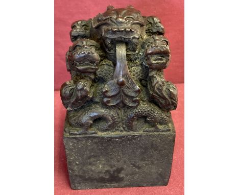 A heavy square shaped Chinese bronze seal with dragon detail. Chinese symbols to underside. Approx. 14cm tall x 8.5cm wide.