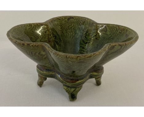 A small ceramic 4 footed quatrefoil shaped censer with unusual striped green glaze.  Approx. 5cm tall x 10.5cm x 8.5cm.