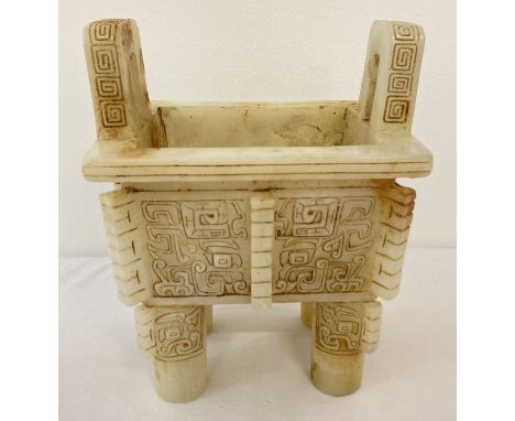 A large rectangular shaped, 4 footed, carved white jade censer. With loop handles. Approx. 20cm tall x 16cm x 12cm.