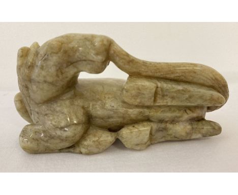 A carved jade figurine of horse.  Approx. 6cm tall x 11.5cm.