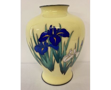 A yellow cloisonné vase of bulbous form with silver base and top rim and iris flower detail.  Approx. 24cm tall.