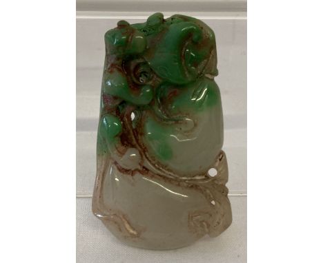 A carved Chinese jade pendant. With carved detail to both sides. Approx. 5.5cm x 3.5cm.