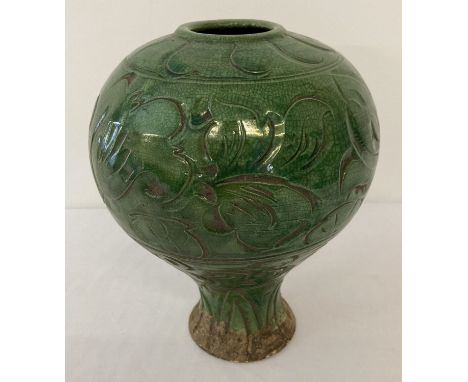 A large ceramic vase of bulbous form with deep green crackle glaze.  Approx. 24cm tall.