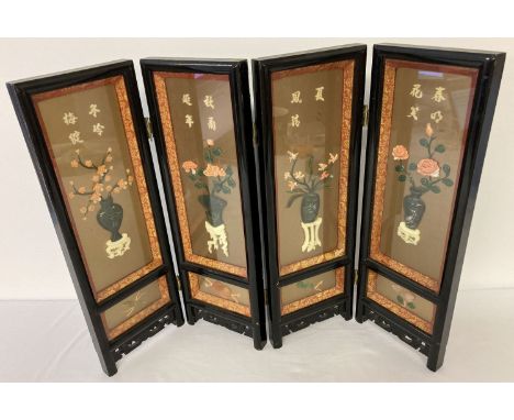 A miniature black lacquer 4 panel screen with jade and coral floral detail. Each panel set with carved jade and coral pieces,