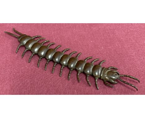 A small bronze figure of a fully articulated centipede.  Approx. 15cm long.