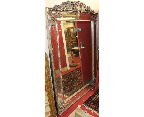 A large contemporary French style floral silvered framed bevelled rectangular floor mirror, with crested surmount, 192 x 136c