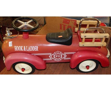 A child's Fire Department push-along fire engine