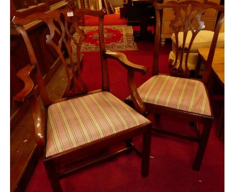A set of twelve 20th century Chippendale style mahogany dining chairs, having striped upholstered drop-in pad seats (10+2)Con