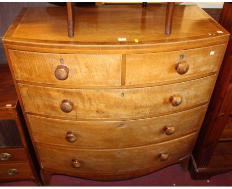 A circa 1900 mahogany, cross banded and further satinwood strung bowfront chest of two short over three long drawers, on spla